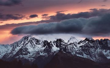 snow covered mountains clouds over it 5k All Mac wallpaper