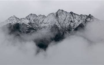 mountains covered in snow MacBook Pro wallpaper