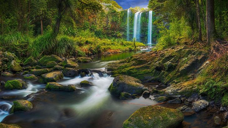 a waterfall flowing through a subtropical forest 8 Mac Wallpaper