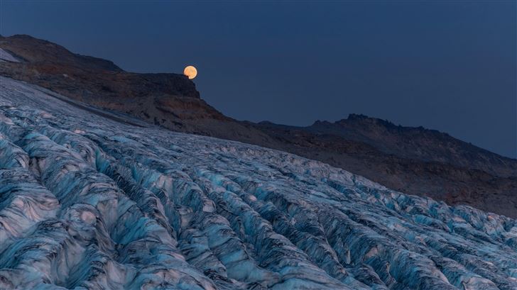 moon rising over a glacier with mountains Mac Wallpaper