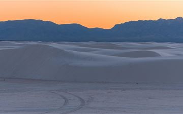 sun is setting over white sands MacBook Air wallpaper