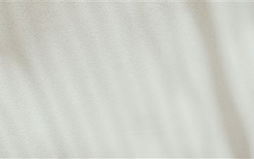 a close up view of a white fabric MacBook Pro  wallpaper