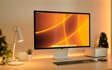 a computer monitor sitting on top of a desk MacBook Pro  wallpaper