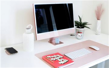 a desktop computer sitting on top of a white desk MacBook Air  wallpaper