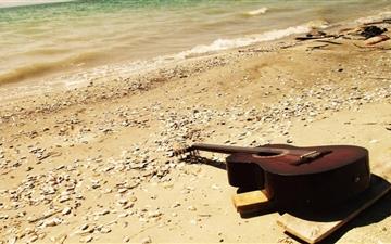 Guitar On The Beach MacBook Air wallpaper