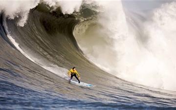A Surfer Rides Down A Wave All Mac wallpaper